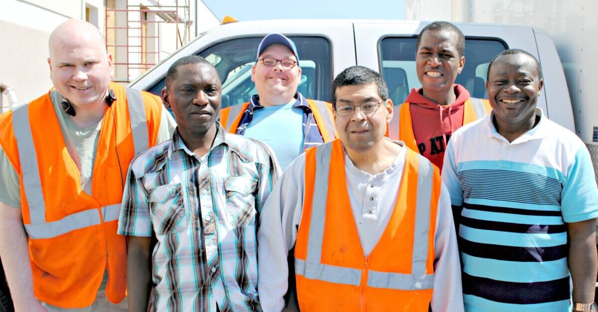 recycling crew wearing orange safety vests