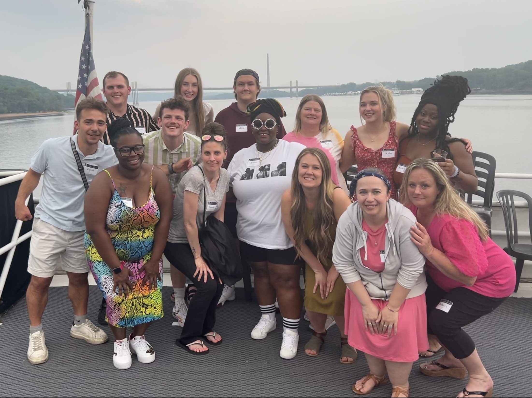 employees posing on bow of the Majestic Star dinner cruiseliner on the St. Criox river during company event