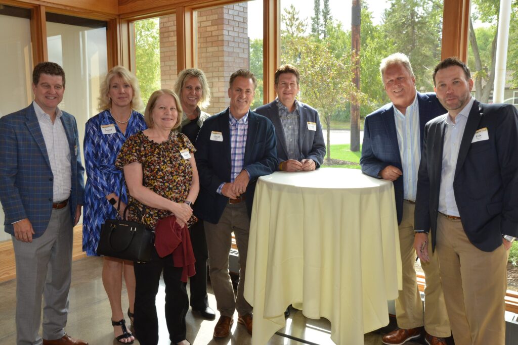 guests reconnecting around a cocktail table preceding the start of lunch