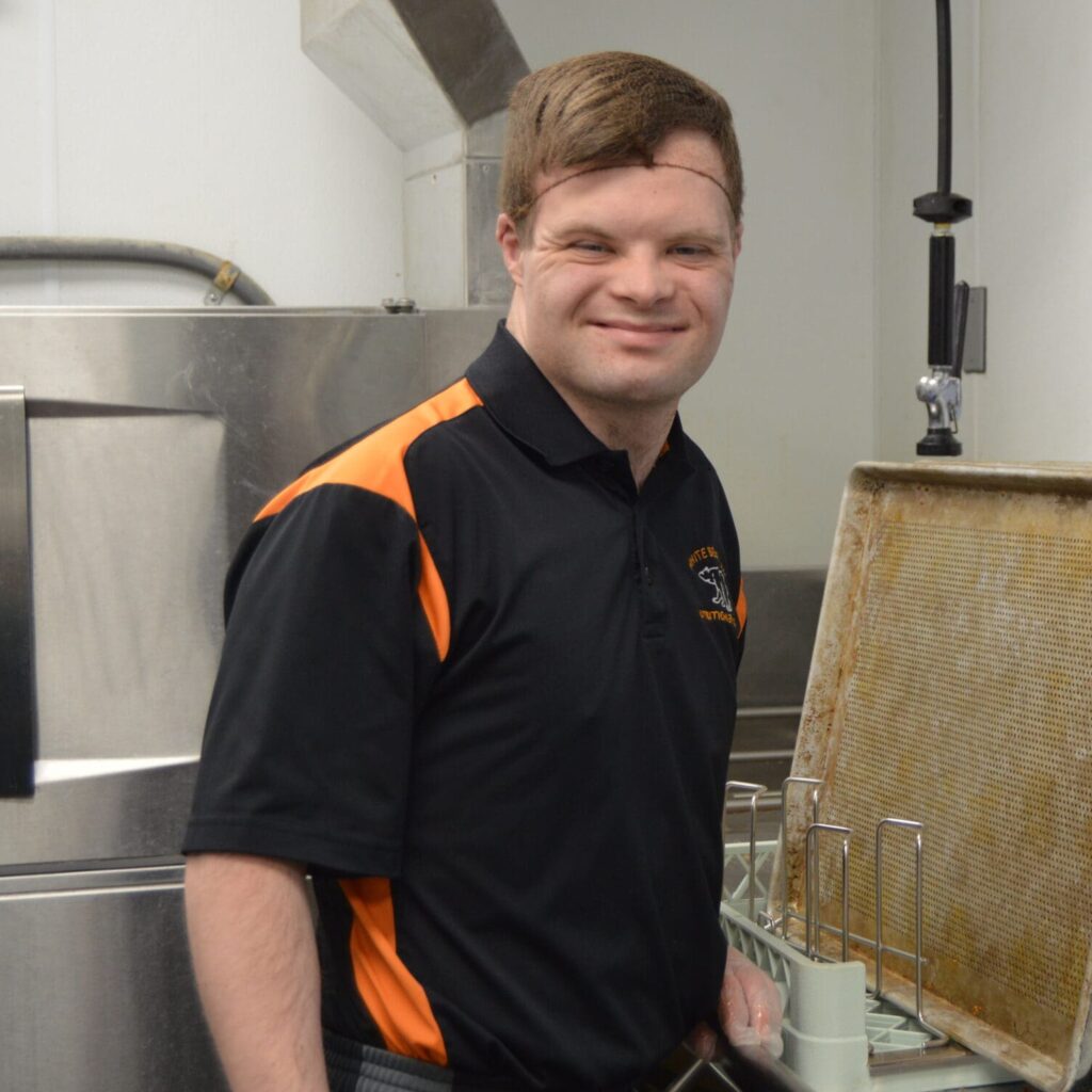 Garrett in the dishwashing area at Mariner Middle School