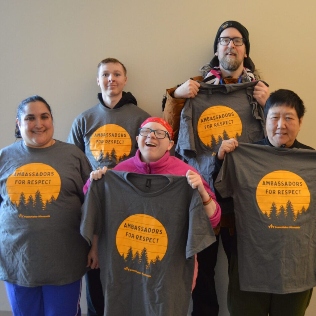 2026 Ambassadors for respect team - 5 individuals wearing and/or holding up their A4R shirts